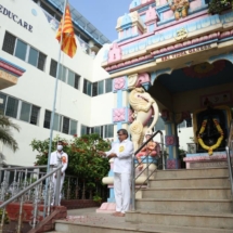 Correspondent Sri S.Loganathan hoisting the Prasanthi Flag